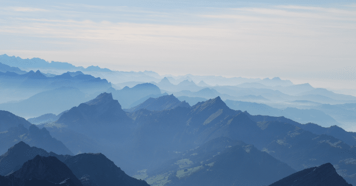 Rocky mountain tops span the landscape.