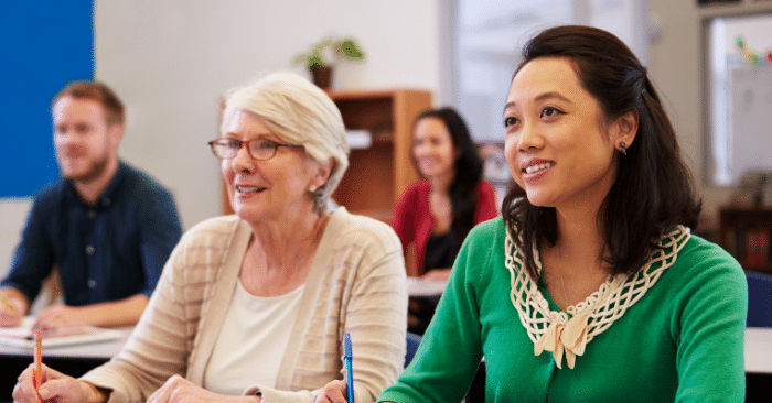 Students of various ages and professional backgrounds attend class.